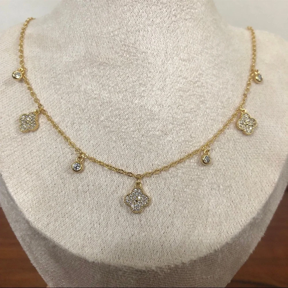 gold dangle station necklace encrusted clover charm round bezel set Cubic Zircon